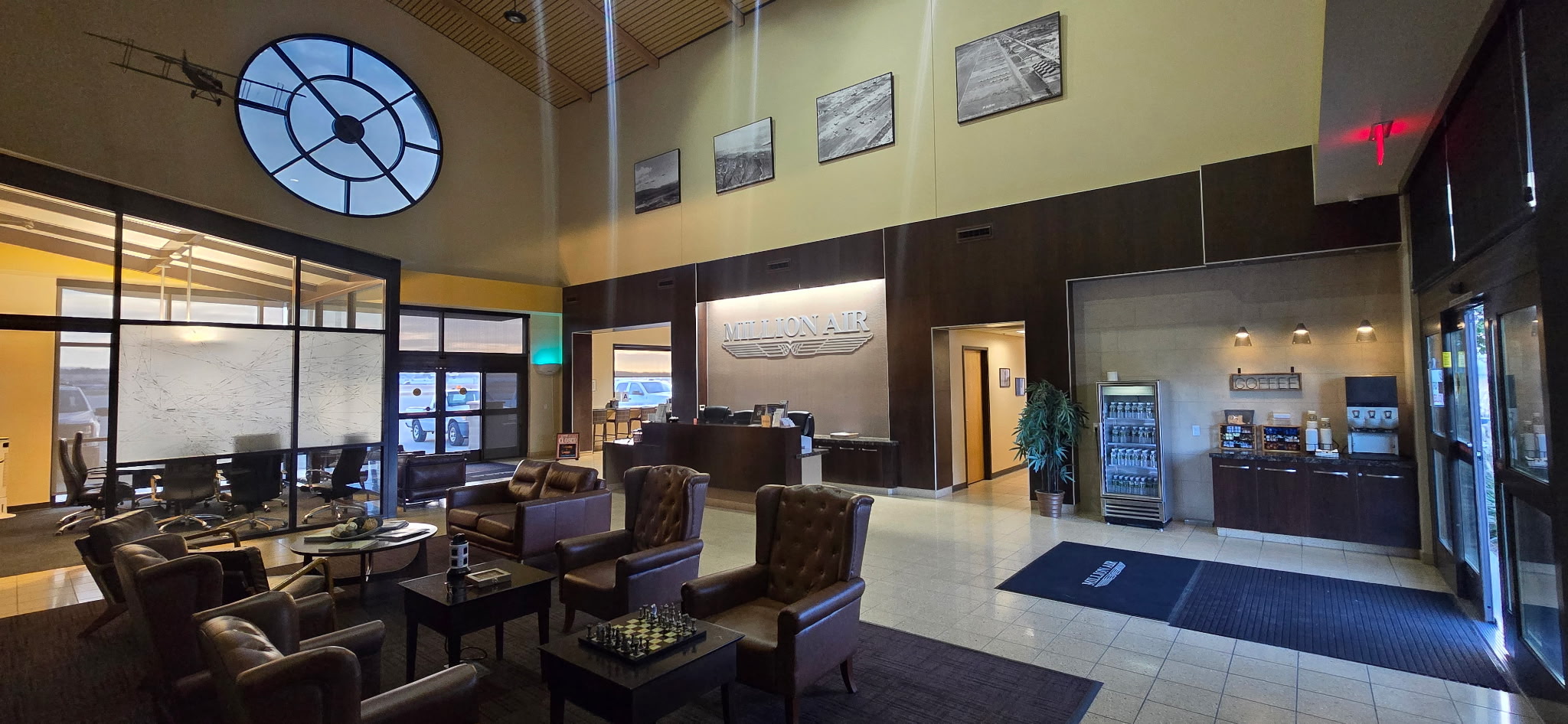 Interior photo of the Riverside FBO lobby with chairs and a coffee bar